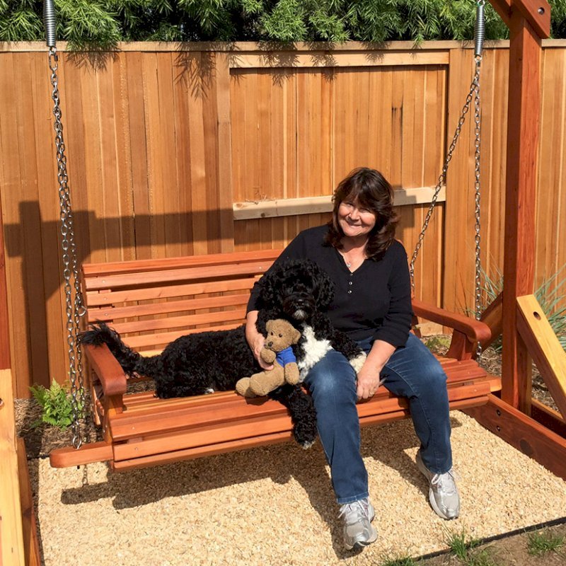 Bench Swing Sets (Options: Large Bench, No Swing Roof, California Redwood, Ensenada Style Seat, No Engraving, Transparent Premium Sealant). Photo Courtesy of Mr. Stephen Carlson of Playa Del Rey, CA. The models are Donna Carlson and her portaguise water dog Scupper Bench Swing Sets (Options: Large Bench, No Swing Roof, California Redwood, Ensenada Style Seat, No Engraving, Transparent Premium Sealant). Photo Courtesy of Mr. Stephen Carlson of Playa Del Rey, CA. The models are Donna Carlson and her portaguise water dog Scupper