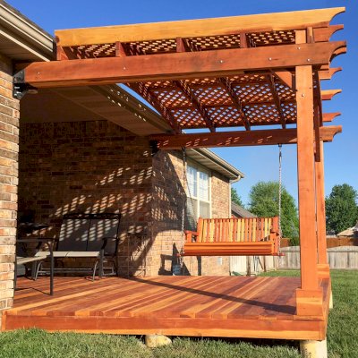 Bench Swings (Seats Only) (Options: Standard Garden Bench, California Redwood, Classic Seat Design, No Engraving, All Beam Hanging Hardware, Transparent Premium Sealant). Photo also shows a custom deck and an attached garden pergola. Photo courtesy of Telory A. of Springfield, MO.