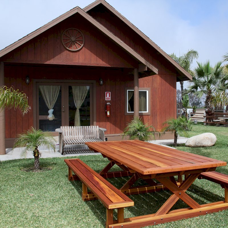 Chris's Picnic Table (Options: 10' L x 46" W, California Redwood, Standard Tabletop, Rounded Corners, No Umbrella Hole, Transparent Premium Sealant). Chris's Picnic Table (Options: 10' L x 46" W, California Redwood, Standard Tabletop, Rounded Corners, No Umbrella Hole, Transparent Premium Sealant).