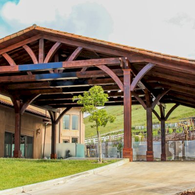 Custom Fat Timber Wood Pavilion Kits (Options: 51' x 47', California Redwood, 9-Post Anchor Kit for High-Wind, Extra Large Timbers and Tile Roof by Custom Request, Custom Light Brown Stain with Urethane). Photo Courtesy of Brent Roles of Gilroy, CA.