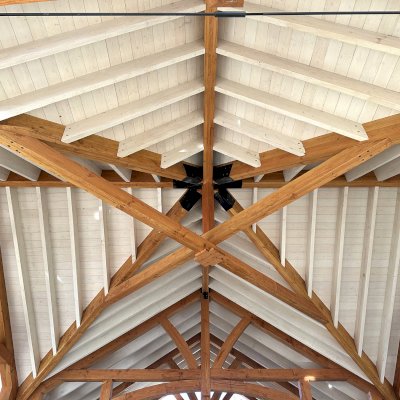 Custom Wood Pavilion (Options: 74' x 74', Douglas-fir, 20-Post Anchor Kit for High-Wind, 10' H Posts, Horizontal Decorative Trims for All Posts, with 5 Ceiling Fan Bases, Transparent Premium Sealant, White Wash for Ceiling). Photo Courtesy of J. Fookes of Elk Creek, CA.
