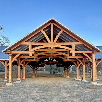 Custom Wood Pavilion (Options: 74' x 74', Douglas-fir, 20-Post Anchor Kit for High-Wind, 10' H Posts, Horizontal Decorative Trims for All Posts, with 5 Ceiling Fan Bases, Transparent Premium Sealant, White Wash for Ceiling). Photo Courtesy of J. Fookes of Elk Creek, CA.