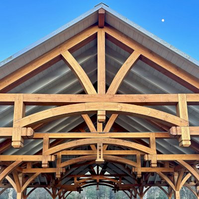Custom Wood Pavilion (Options: 74' x 74', Douglas-fir, 20-Post Anchor Kit for High-Wind, 10' H Posts, Horizontal Decorative Trims for All Posts, with 5 Ceiling Fan Bases, Transparent Premium Sealant, White Wash for Ceiling). Photo Courtesy of J. Fookes of Elk Creek, CA.