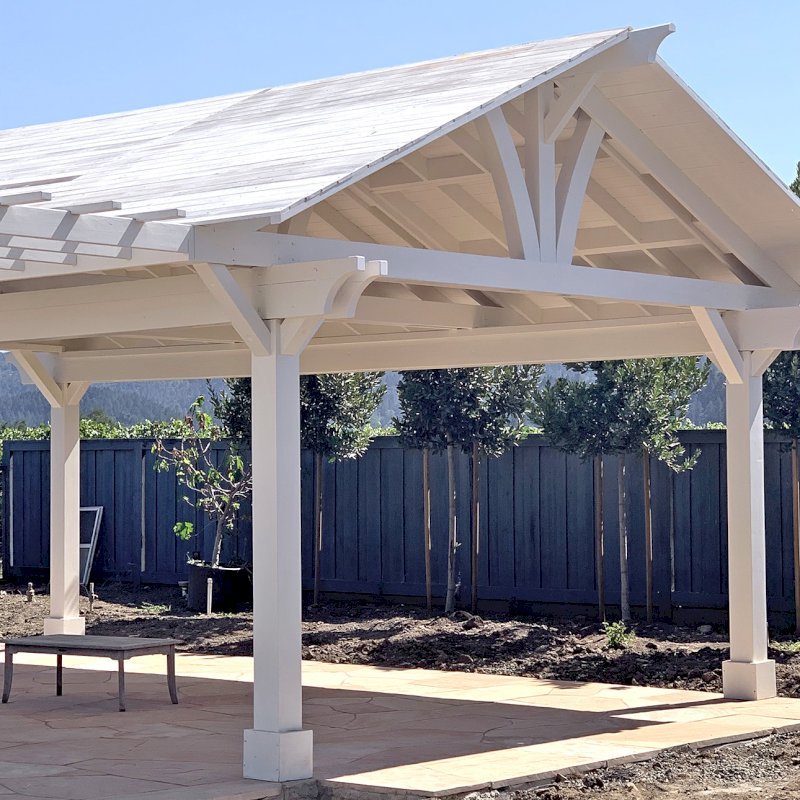 Custom Wood Pavilion Kits (Options: 28' L x 20' W, California Redwood, No Electrical Wiring Trim Kit, Gale-Wind Anchors, Custom White Paint) with a Garden Pergola Attached. Photo Courtesy of M. Hansen of St. Helena, California. Custom Wood Pavilion Kits (Options: 28' L x 20' W, California Redwood, No Electrical Wiring Trim Kit, Gale-Wind Anchors, Custom White Paint) with a Garden Pergola Attached. Photo Courtesy of M. Hansen of St. Helena, California.
