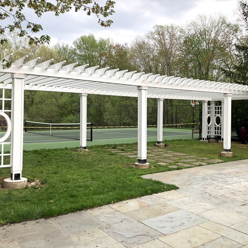 Custom Wooden Fat Timber Pergola (Options: 40' x 18', California Redwood, Posts Anchor Kit for Gale-Wind, Custom Trellis Between Corner Posts, Off-White Oil-Based Primer). Photo Courtesy of L. Hascoe of Greenwich, CT. Custom copper caps atop all posts. Custom Wooden Fat Timber Pergola (Options: 40' x 18', California Redwood, Posts Anchor Kit for Gale-Wind, Custom Trellis Between Corner Posts, Off-White Oil-Based Primer). Photo Courtesy of L. Hascoe of Greenwich, CT. Custom copper caps atop all posts.