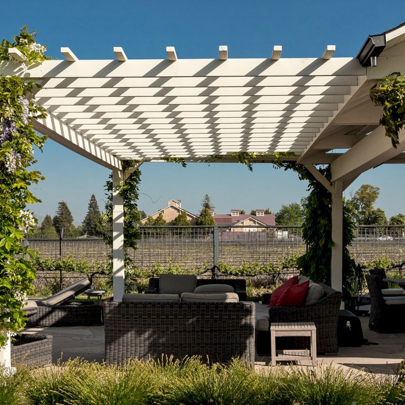 Custom Wooden Pergola with Attached Pavilion (Options: 26' L x 12' W, California Redwood, No Electrical Wiring Trim Kit, Post Anchor Kit for High-Wind, Custom White Paint) with a Garden Pergola Attached. Photo Courtesy of M. Hansen of St. Helena, California. Custom Wooden Pergola with Attached Pavilion (Options: 26' L x 12' W, California Redwood, No Electrical Wiring Trim Kit, Post Anchor Kit for High-Wind, Custom White Paint) with a Garden Pergola Attached. Photo Courtesy of M. Hansen of St. Helena, California.