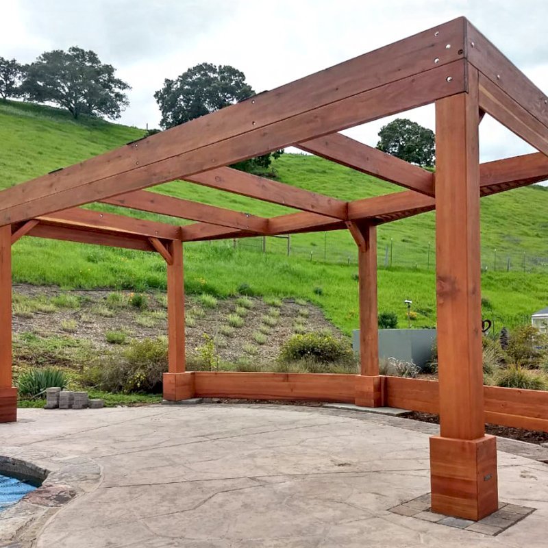 Custom Wooden Pergola (Options: 20' x 12', Mature Redwood, Posts Anchor Kit for High-Wind, Transparent Premium Sealant). Photo Courtesy of D. Ruprecht of Hollister, CA. Custom Wooden Pergola (Options: 20' x 12', Mature Redwood, Posts Anchor Kit for High-Wind, Transparent Premium Sealant). Photo Courtesy of D. Ruprecht of Hollister, CA.