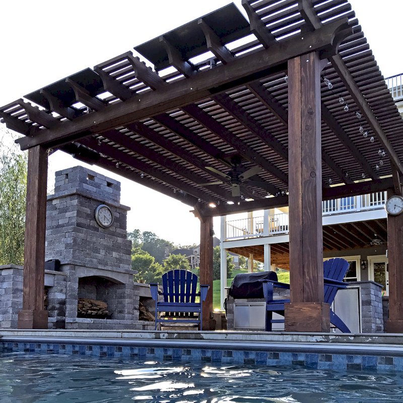 Custom Garden Pergola (Options: 16' L x 16' W, California Redwood, 4-Post Anchor Kit for Concrete, Cherry Stain Premium Sealant). Plumbing was built into the timbers to create a waterfall. Photo Courtesy of D. Hogan of Charlottesville, Virginia. Custom Garden Pergola (Options: 16' L x 16' W, California Redwood, 4-Post Anchor Kit for Concrete, Cherry Stain Premium Sealant). Plumbing was built into the timbers to create a waterfall. Photo Courtesy of D. Hogan of Charlottesville, Virginia.