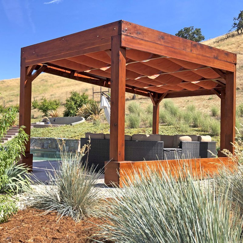 Custom Pergolas (Options: 20' x 12', Mature Redwood, Posts Anchor Kit for Hurricane, Transparent Premium Sealant). Retractable Shade Canopies Installed by Customer. Photo Courtesy of D. Ruprecht of Hollister, CA. Custom Pergolas (Options: 20' x 12', Mature Redwood, Posts Anchor Kit for Hurricane, Transparent Premium Sealant). Retractable Shade Canopies Installed by Customer. Photo Courtesy of D. Ruprecht of Hollister, CA.