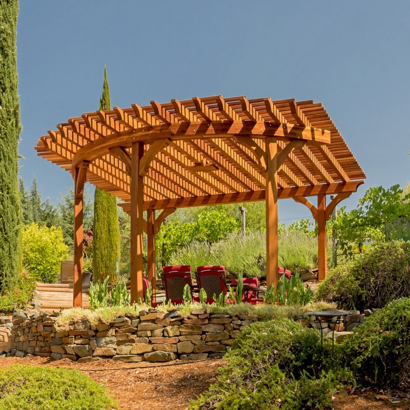Custom Wooden Pergola (Options: 17' L x 17' W, California Redwood, Electrical Wiring Trim for 1 Post, 5-Post Anchor Kit for Concrete, No Ceiling Fan Base, No Privacy Panels, No Curtain Rods, Transparent Premium Sealant). Photo Courtesy of K. Drahmann of El Dorado Hills, CA. Custom Wooden Pergola (Options: 17' L x 17' W, California Redwood, Electrical Wiring Trim for 1 Post, 5-Post Anchor Kit for Concrete, No Ceiling Fan Base, No Privacy Panels, No Curtain Rods, Transparent Premium Sealant). Photo Courtesy of K. Drahmann of El Dorado Hills, CA.