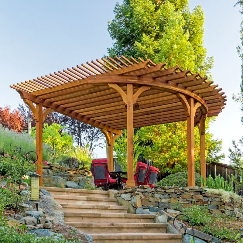 Custom Wooden Pergola (Options: 17' L x 17' W, California Redwood, Electrical Wiring Trim for 1 Post, 5-Post Anchor Kit for Concrete, No Ceiling Fan Base, No Privacy Panels, No Curtain Rods, Transparent Premium Sealant). Photo Courtesy of K. Drahmann of El Dorado Hills, CA. Custom Wooden Pergola (Options: 17' L x 17' W, California Redwood, Electrical Wiring Trim for 1 Post, 5-Post Anchor Kit for Concrete, No Ceiling Fan Base, No Privacy Panels, No Curtain Rods, Transparent Premium Sealant). Photo Courtesy of K. Drahmann of El Dorado Hills, CA.