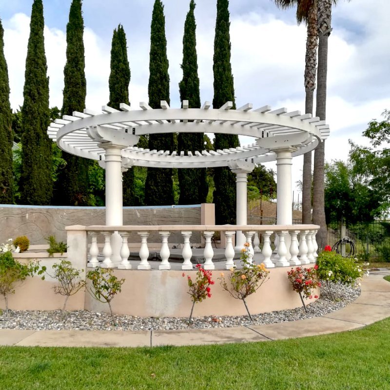 Custom Wooden Pergola (Options: 20'-6" Diameter, Mature Redwood, Placed Atop Load Bearing Columns, White Primer). Photo Courtesy of K. Pathak of Fremont, California. Custom Wooden Pergola (Options: 20'-6" Diameter, Mature Redwood, Placed Atop Load Bearing Columns, White Primer). Photo Courtesy of K. Pathak of Fremont, California.