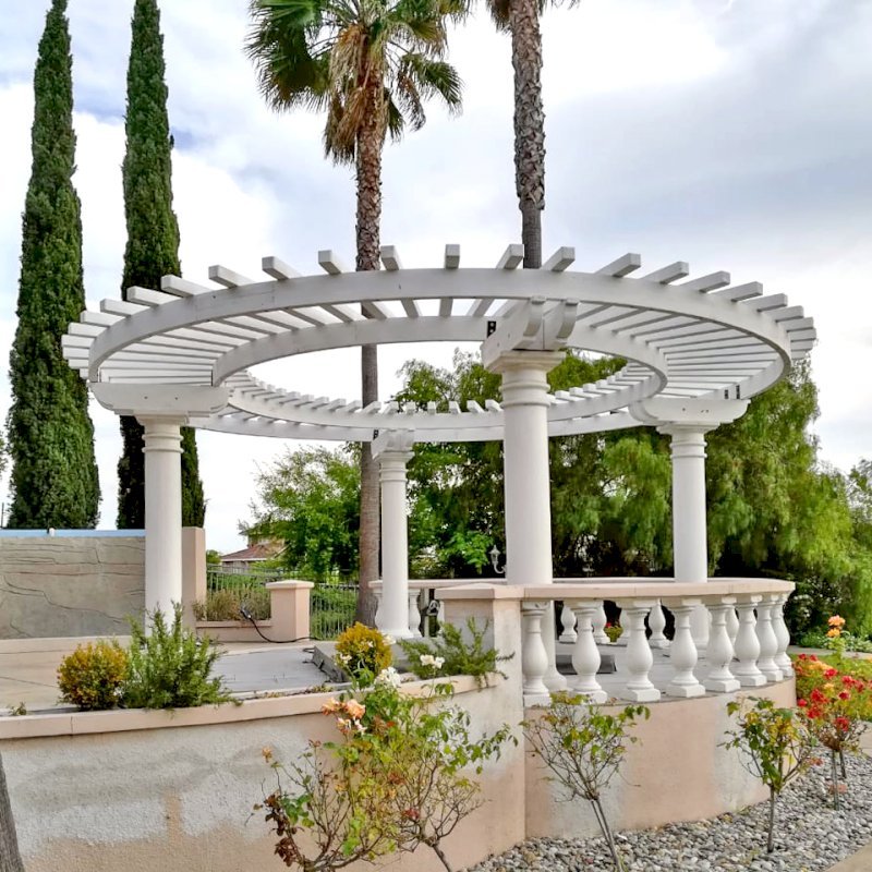 Custom Wooden Pergola (Options: 20'-6" Diameter, Mature Redwood, Placed Atop Load Bearing Columns, White Primer). Photo Courtesy of K. Pathak of Fremont, California. Custom Wooden Pergola (Options: 20'-6" Diameter, Mature Redwood, Placed Atop Load Bearing Columns, White Primer). Photo Courtesy of K. Pathak of Fremont, California.
