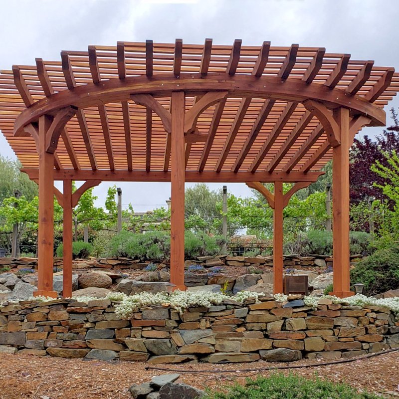 Custom Wooden Pergola (Options: 17' L x 17' W, California Redwood, Electrical Wiring Trim for 1 Post, 5-Post Anchor Kit for Concrete, No Ceiling Fan Base, No Privacy Panels, No Curtain Rods, Transparent Premium Sealant). Photo Courtesy of K. Drahmann of El Dorado Hills, CA. Custom Wooden Pergola (Options: 17' L x 17' W, California Redwood, Electrical Wiring Trim for 1 Post, 5-Post Anchor Kit for Concrete, No Ceiling Fan Base, No Privacy Panels, No Curtain Rods, Transparent Premium Sealant). Photo Courtesy of K. Drahmann of El Dorado Hills, CA.