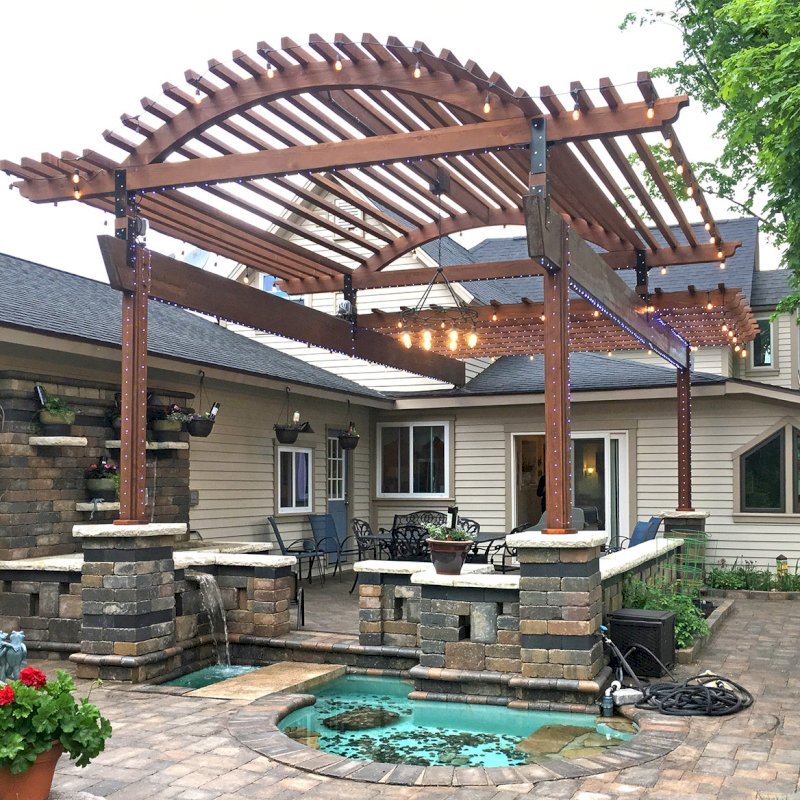 Custom Wooden Pergola (Options: 30' L x 18' W, California Redwood, No Electrical Wiring Trim, Trims to Cover 3 Metal Posts Installed by Customer, Coffee-Stain Premium Sealant). Photo Courtesy of K. Lufkin of Petoskey, Michigan. Custom Wooden Pergola (Options: 30' L x 18' W, California Redwood, No Electrical Wiring Trim, Trims to Cover 3 Metal Posts Installed by Customer, Coffee-Stain Premium Sealant). Photo Courtesy of K. Lufkin of Petoskey, Michigan.