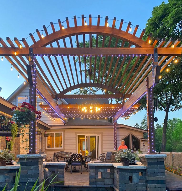 Custom Wooden Pergola (Options: 30' L x 18' W, California Redwood, No Electrical Wiring Trim, Trims to Cover 3 Metal Posts Installed by Customer, Coffee-Stain Premium Sealant). Photo Courtesy of K. Lufkin of Petoskey, Michigan. Custom Wooden Pergola (Options: 30' L x 18' W, California Redwood, No Electrical Wiring Trim, Trims to Cover 3 Metal Posts Installed by Customer, Coffee-Stain Premium Sealant). Photo Courtesy of K. Lufkin of Petoskey, Michigan.