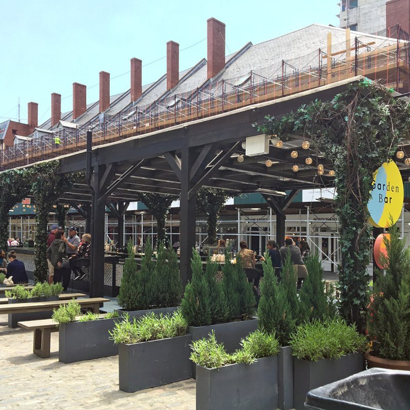 Custom Wooden Pergola (Options: 82' L x 16' W, Douglas-fir, Open Roof with Rafters at 18", with Transparent Rain Guard, 12-Post Anchor Kit, No Ceiling Fan Base, 12' Post Height, Custom Black Paint). This pergola is part of the giant popup beer hall at the Southside Seaport in downtown Manhattan from May to Oct 2017: https://www.timeout.com/newyork/blog/a-giant-pop-up-beer-hall-is-opening-at-south-street-seaport-this-summer-032417 Custom Wooden Pergola (Options: 82' L x 16' W, Douglas-fir, Open Roof with Rafters at 18", with Transparent Rain Guard, 12-Post Anchor Kit, No Ceiling Fan Base, 12' Post Height, Custom Black Paint). This pergola is part of the giant popup beer hall at the Southside Seaport in downtown Manhattan from May to Oct 2017: https://www.timeout.com/newyork/blog/a-giant-pop-up-beer-hall-is-opening-at-south-street-seaport-this-summer-032417