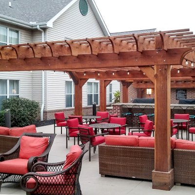 Custom Wooden Fat Timber Pergola (Options: 20' x 20', California Redwood, Electrical Wiring Trim for 1 Post, Open Roof with Rafters at 18", Slats at 12", 4-Post Anchor Kit for Concrete, No Ceiling Fan Bases, No Privacy Panels, No Curtain Rods, Transparent Premium Sealant). Thicker Lumber by Custom Request, 2 x 12 Rafters & Supports, 10 x10 Posts. Photo Courtesy of Homewood Suites by Hilton, Mechanicsburg, PA.