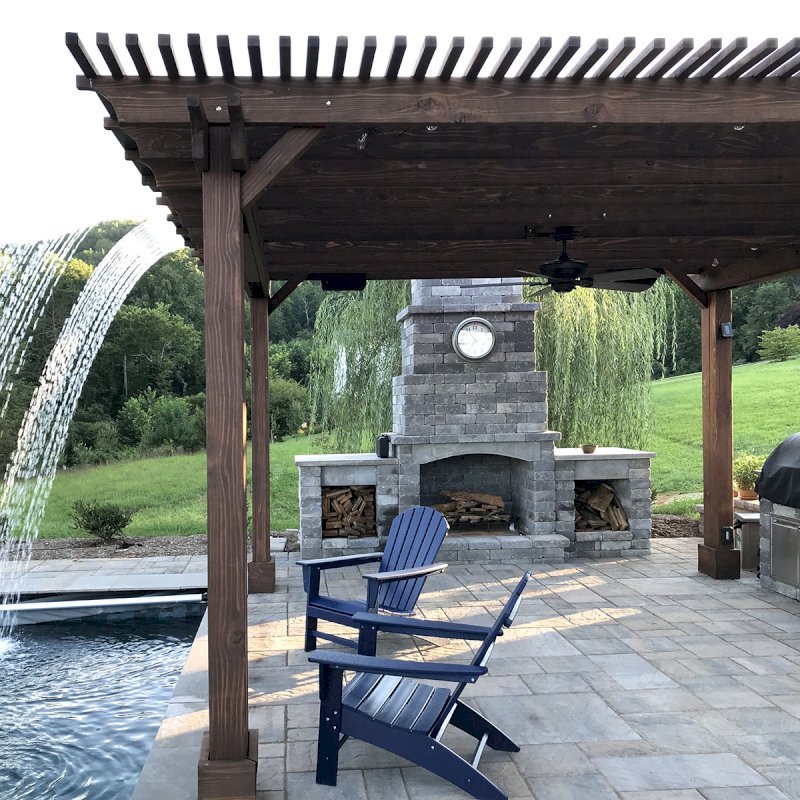 Custom Garden Pergola (Options: 16' L x 16' W, California Redwood, 4-Post Anchor Kit for Concrete, Cherry Stain Premium Sealant). Plumbing was built into the timbers to create a waterfall. Photo Courtesy of D. Hogan of Charlottesville, Virginia. Custom Garden Pergola (Options: 16' L x 16' W, California Redwood, 4-Post Anchor Kit for Concrete, Cherry Stain Premium Sealant). Plumbing was built into the timbers to create a waterfall. Photo Courtesy of D. Hogan of Charlottesville, Virginia.