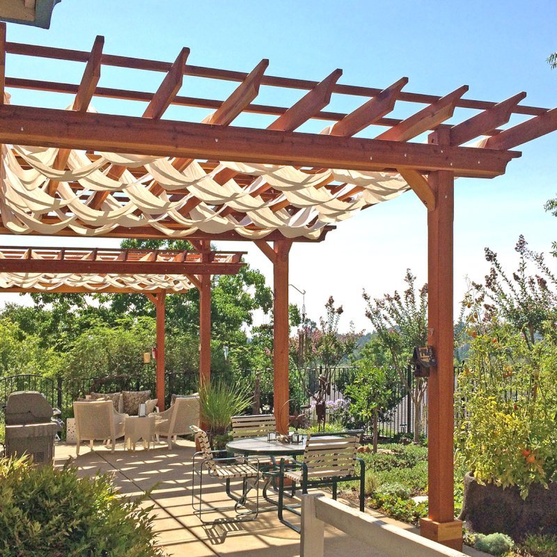 Custom Wooden Pergola (Options: 35' L, 13' W, California Redwood, No Electrical Wiring Trim, 4-Post Anchor Kit for Concrete, No Privacy Panels, No Curtain Rods, 10' & 11' Post Height, Transparent Premium Sealant). Photo Courtesy of D. Drake of Auburn, CA. Custom Wooden Pergola (Options: 35' L, 13' W, California Redwood, No Electrical Wiring Trim, 4-Post Anchor Kit for Concrete, No Privacy Panels, No Curtain Rods, 10' & 11' Post Height, Transparent Premium Sealant). Photo Courtesy of D. Drake of Auburn, CA.