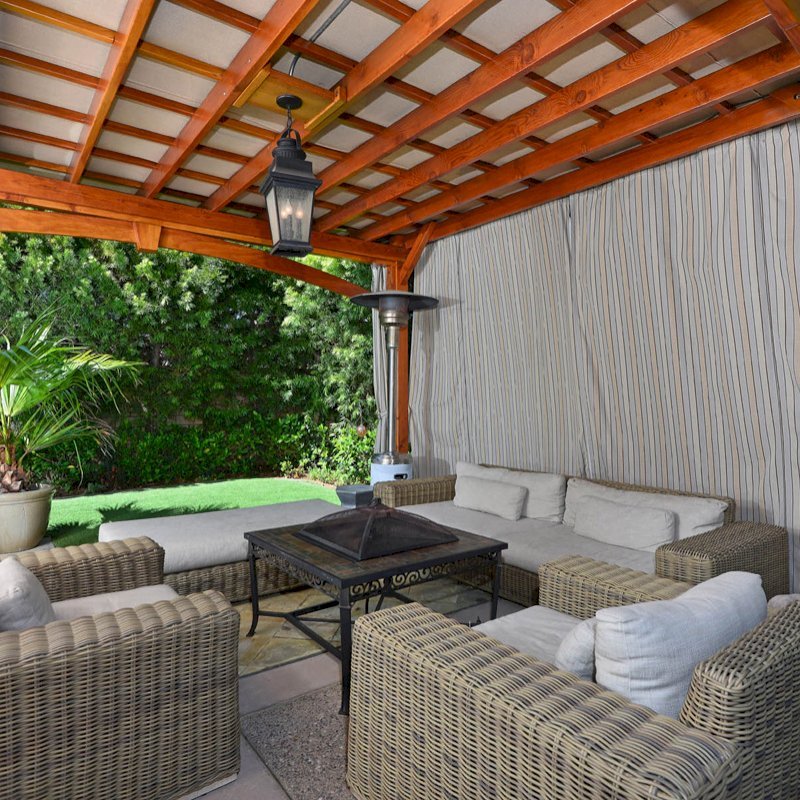 Custom Wooden Pergola (Options: 17' x 15', California Redwood, 1 Ceiling Fan Base, Custom Arched Brace on Supports Side, Transparent Premium Sealant). Photo Courtesy of Jason Jager. Custom Wooden Pergola (Options: 17' x 15', California Redwood, 1 Ceiling Fan Base, Custom Arched Brace on Supports Side, Transparent Premium Sealant). Photo Courtesy of Jason Jager.
