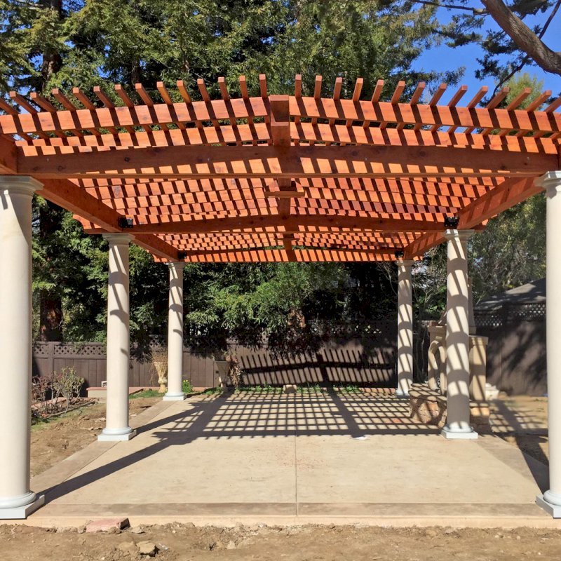Custom Wooden Pergola (Options: 19' x 32', Mature Redwood, 4-Post Anchor Kit for High-Wind, Trasnparent Premium Sealant). Customer Placed Tuscan Columns Around the Pergola Posts. Photo Courtesy of M. McCook of San Mateo, CA. Custom Wooden Pergola (Options: 19' x 32', Mature Redwood, 4-Post Anchor Kit for High-Wind, Trasnparent Premium Sealant). Customer Placed Tuscan Columns Around the Pergola Posts. Photo Courtesy of M. McCook of San Mateo, CA.