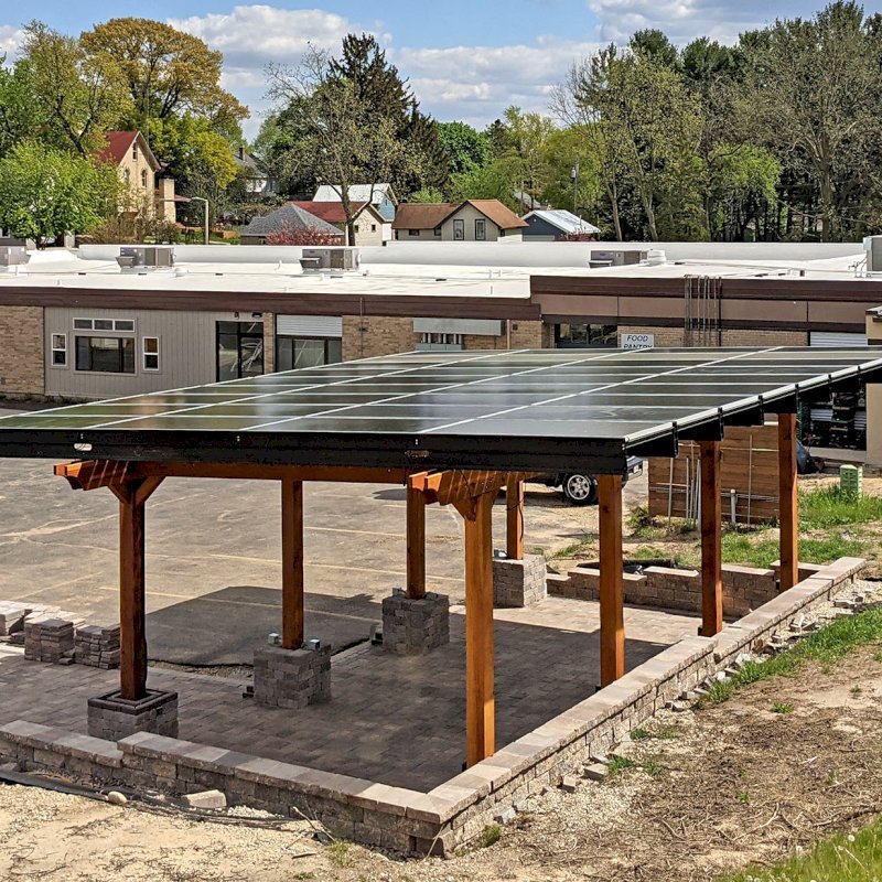 The Solar Panel Pergola (Options: California Redwood, 8-Post Anchor Kit for High-Wind, Transparent Premium Sealant). Photo Courtesy of Cal Couillard of Deerfield, Wisconsin. The Solar Panel Pergola (Options: California Redwood, 8-Post Anchor Kit for High-Wind, Transparent Premium Sealant). Photo Courtesy of Cal Couillard of Deerfield, Wisconsin.