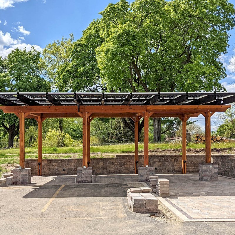 The Solar Panel Pergola (Options: California Redwood, 8-Post Anchor Kit for High-Wind, Transparent Premium Sealant). Photo Courtesy of Cal Couillard of Deerfield, Wisconsin. The Solar Panel Pergola (Options: California Redwood, 8-Post Anchor Kit for High-Wind, Transparent Premium Sealant). Photo Courtesy of Cal Couillard of Deerfield, Wisconsin.