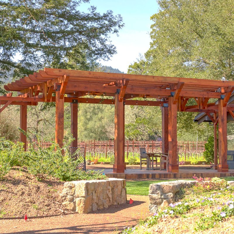 Custom Wooden Pergola (Options: 28' x 20', California Redwood, Posts Anchor Kit for Concrete, Transparent Premium Sealant). Photo Courtesy of S. Taplin of St. Helena, CA. Custom Wooden Pergola (Options: 28' x 20', California Redwood, Posts Anchor Kit for Concrete, Transparent Premium Sealant). Photo Courtesy of S. Taplin of St. Helena, CA.