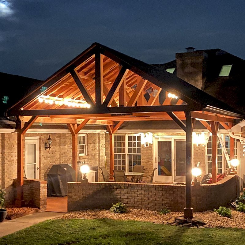 Del Norte Outdoor Kitchen Pavilion (Options: 26' L x 20' W, California Redwood, 6-Post Kit for Gale-Wind, 2 Ceiling Fan Bases, 2 Electrical Wiring Trim Kits, No Post Decorative Trims, Transparent Premium Sealant, with Custom Steel Plating). Roof pitch increased beyond standard amount by customer request. Photo Courtesy of G. Dalby of Knoxville , Tennessee. Del Norte Outdoor Kitchen Pavilion (Options: 26' L x 20' W, California Redwood, 6-Post Kit for Gale-Wind, 2 Ceiling Fan Bases, 2 Electrical Wiring Trim Kits, No Post Decorative Trims, Transparent Premium Sealant, with Custom Steel Plating). Roof pitch increased beyond standard amount by customer request. Photo Courtesy of G. Dalby of Knoxville , Tennessee.
