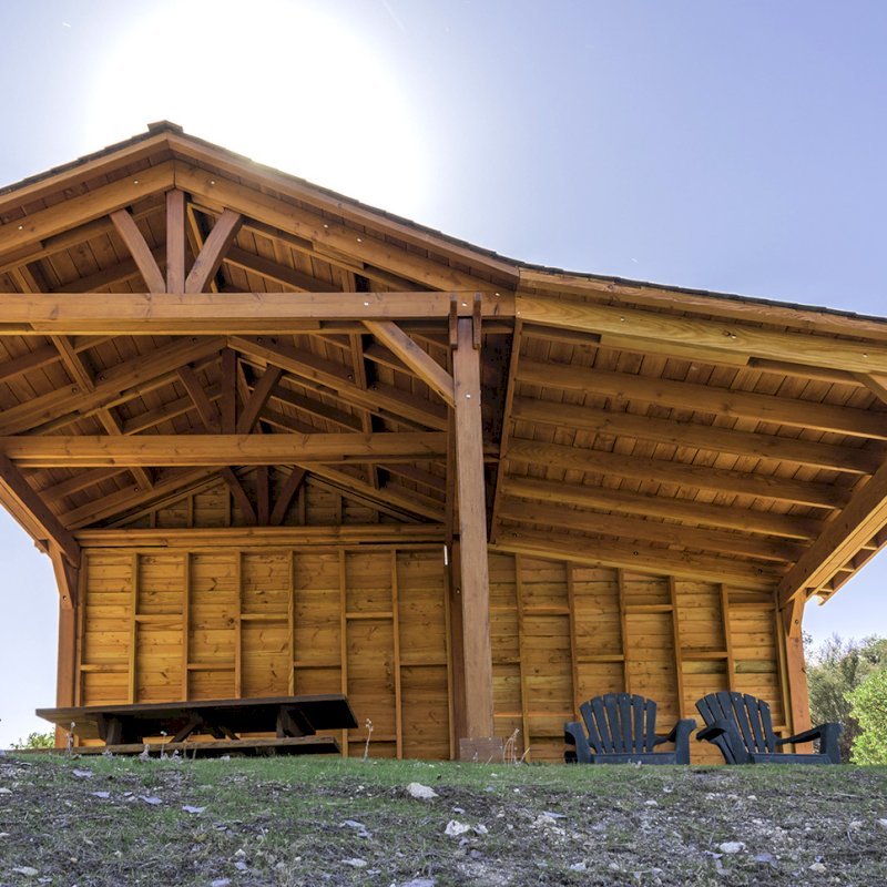 Custom Del Norte Outdoor Kitchen Pavilion (Options: 12' L x 12' W, with 9' x 12' Shed Pavilion Attached, Douglas-fir, 6-Post Kit for High-Wind, No Ceiling Fan Base, No Electrical Wiring Trim Kit, No Post Decorative Trims, with Custom Solid Wall, Transparent Premium Sealant). Photo Courtesy of J. Randall of Warner Springs, CA. Custom Del Norte Outdoor Kitchen Pavilion (Options: 12' L x 12' W, with 9' x 12' Shed Pavilion Attached, Douglas-fir, 6-Post Kit for High-Wind, No Ceiling Fan Base, No Electrical Wiring Trim Kit, No Post Decorative Trims, with Custom Solid Wall, Transparent Premium Sealant). Photo Courtesy of J. Randall of Warner Springs, CA.