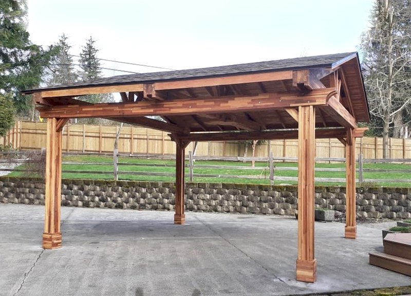 Del Norte Outdoor Kitchen Pavilion (Options: 18' L x 18' W, Mosaic Eco-Wood, 4-Post Kit for Concrete, No Ceiling Fan Base, No Electrical Wiring Trim Kit, Vertical Post Decorative Trim, Transparent Premium Sealant). Photo Courtesy of L. Foulk of Maple Valley, Washington. Del Norte Outdoor Kitchen Pavilion (Options: 18' L x 18' W, Mosaic Eco-Wood, 4-Post Kit for Concrete, No Ceiling Fan Base, No Electrical Wiring Trim Kit, Vertical Post Decorative Trim, Transparent Premium Sealant). Photo Courtesy of L. Foulk of Maple Valley, Washington.