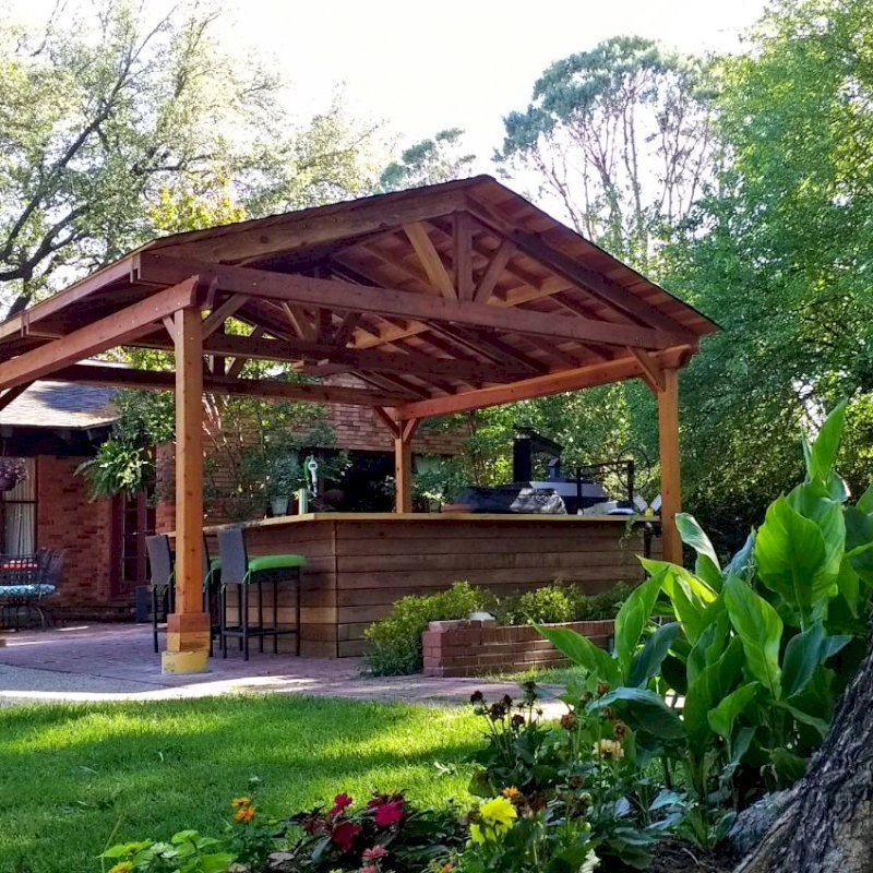 Del Norte Outdoor Kitchen Pavilion (Options: 18' L x 18' W, California Redwood, 4-Post Kit for Concrete, With a Ceiling Fan Base, Electrical Wiring Trim Kit for 2 Posts, Transparent Premium Sealant). Photo Courtesy of D. Blakelock of Dallas, TX. Del Norte Outdoor Kitchen Pavilion (Options: 18' L x 18' W, California Redwood, 4-Post Kit for Concrete, With a Ceiling Fan Base, Electrical Wiring Trim Kit for 2 Posts, Transparent Premium Sealant). Photo Courtesy of D. Blakelock of Dallas, TX.