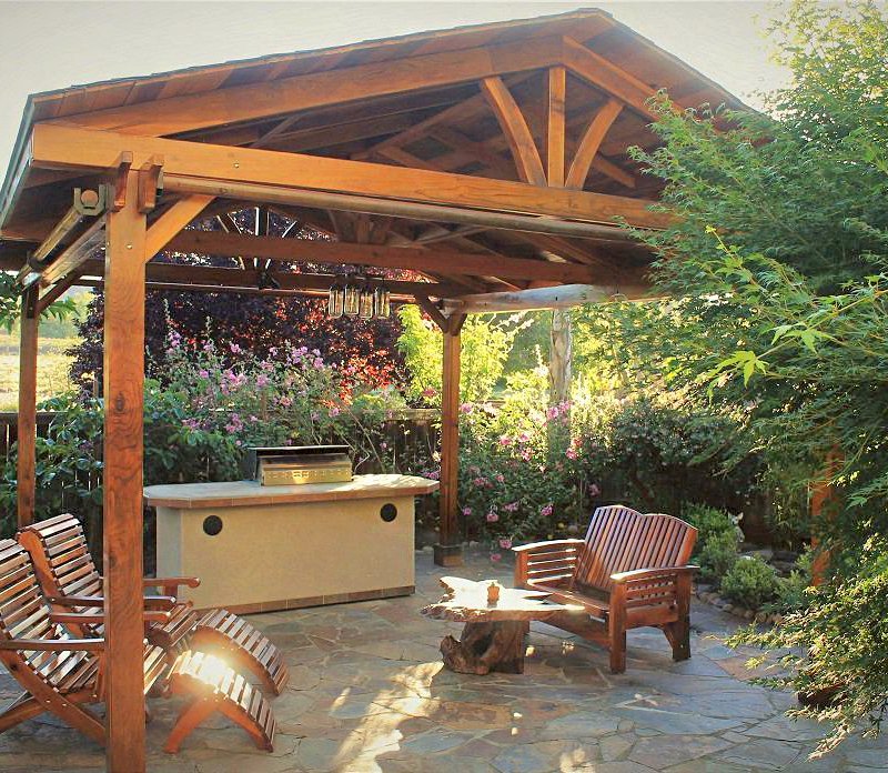 Del Norte Outdoor Kitchen Pavilion (Options: 16' L x 19' W, California Redwood, 4-Post Kit for Concrete, 4 Curtain Rods, No Ceiling Fan Base, Electrical Wiring Trim Kit for 2 Posts, Transparent Premium Sealant). Photo also shows a Loveseat and two Ensenada Easychairs with Ottoman. Photo Courtesy of D. Leetz of Petaluma, CA. Del Norte Outdoor Kitchen Pavilion (Options: 16' L x 19' W, California Redwood, 4-Post Kit for Concrete, 4 Curtain Rods, No Ceiling Fan Base, Electrical Wiring Trim Kit for 2 Posts, Transparent Premium Sealant). Photo also shows a Loveseat and two Ensenada Easychairs with Ottoman. Photo Courtesy of D. Leetz of Petaluma, CA.