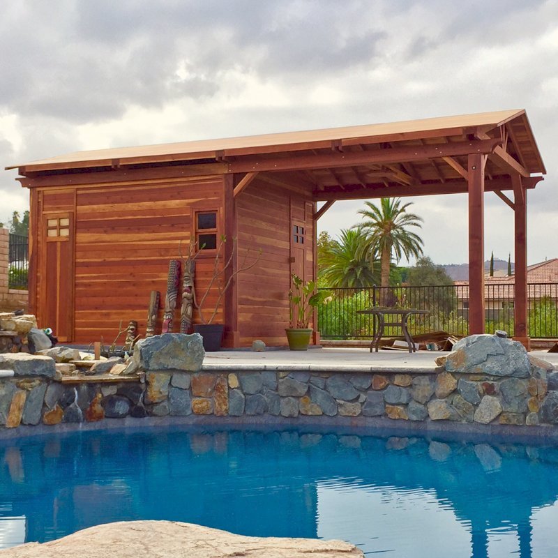 Custom Del Norte Outdoor Kitchen Pavilion with enclosed bathroom and front "porch area" (Options: 28' L x 14' W, California Redwood, 6-Post Kit for Gale-Wind, No Ceiling Fan Base, Electrical Wiring Trim Kit for 1 Post, Transparent Premium Sealant). Photo Courtesy of C. Nelson of Riverside, CA. Final roofing skin (composite shingles) was added a few days after these pictures were taken. Custom Del Norte Outdoor Kitchen Pavilion with enclosed bathroom and front "porch area" (Options: 28' L x 14' W, California Redwood, 6-Post Kit for Gale-Wind, No Ceiling Fan Base, Electrical Wiring Trim Kit for 1 Post, Transparent Premium Sealant). Photo Courtesy of C. Nelson of Riverside, CA. Final roofing skin (composite shingles) was added a few days after these pictures were taken.