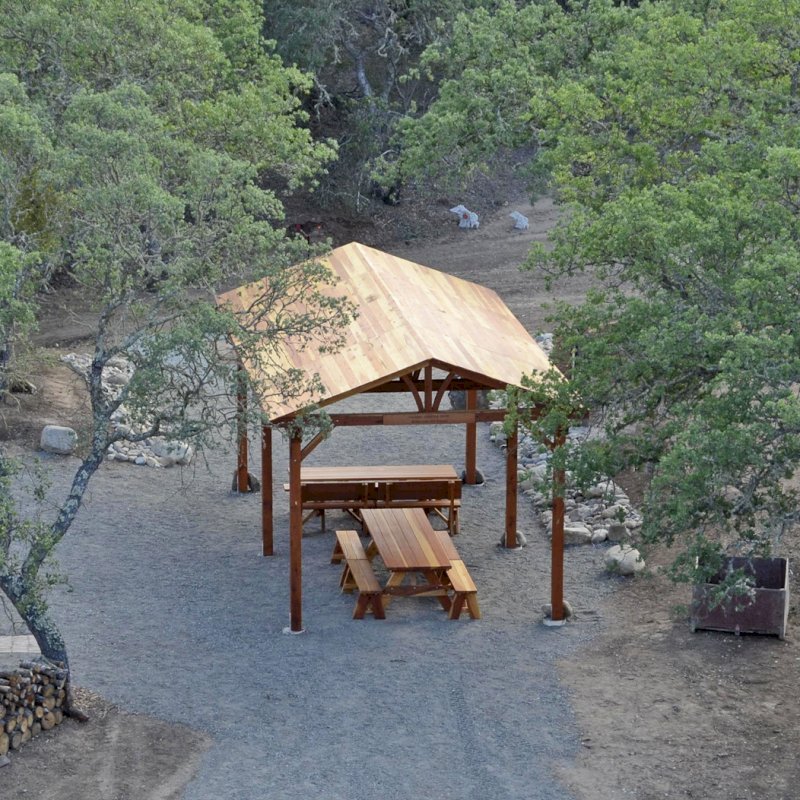 Del Norte Outdoor Kitchen Pavilion (Options: 28' L x 14' W, California Redwood, 6-Post Kit for Concrete, No Ceiling Fan Base, Transparent Premium Sealant) with 2 Picnic Table Sets with Benches. Photo Courtesy of Russ Dotson of The Oak Hill Ranch in Paicines, CA. Del Norte Outdoor Kitchen Pavilion (Options: 28' L x 14' W, California Redwood, 6-Post Kit for Concrete, No Ceiling Fan Base, Transparent Premium Sealant) with 2 Picnic Table Sets with Benches. Photo Courtesy of Russ Dotson of The Oak Hill Ranch in Paicines, CA.