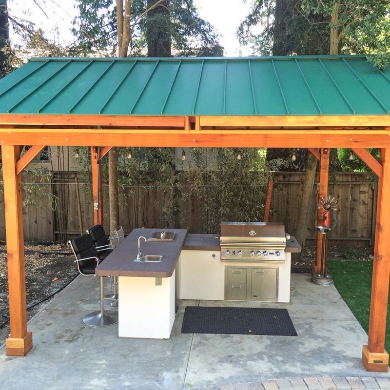 Del Norte Outdoor Kitchen Pavilion (Options: 16' L x 13' W, California Redwood, Unattached, 4-Post Kit for Hurricane, No Electrical Wiring Trim, 9' Posts, No Ceiling Fan Base, No Privacy Panels, No Curtain Rods, Transparent Premium Sealant). Standing Seam Metal Roof added by Customer Request. Photo Courtesy of Steve Aber of Atherton, CA. Del Norte Outdoor Kitchen Pavilion (Options: 16' L x 13' W, California Redwood, Unattached, 4-Post Kit for Hurricane, No Electrical Wiring Trim, 9' Posts, No Ceiling Fan Base, No Privacy Panels, No Curtain Rods, Transparent Premium Sealant). Standing Seam Metal Roof added by Customer Request. Photo Courtesy of Steve Aber of Atherton, CA.
