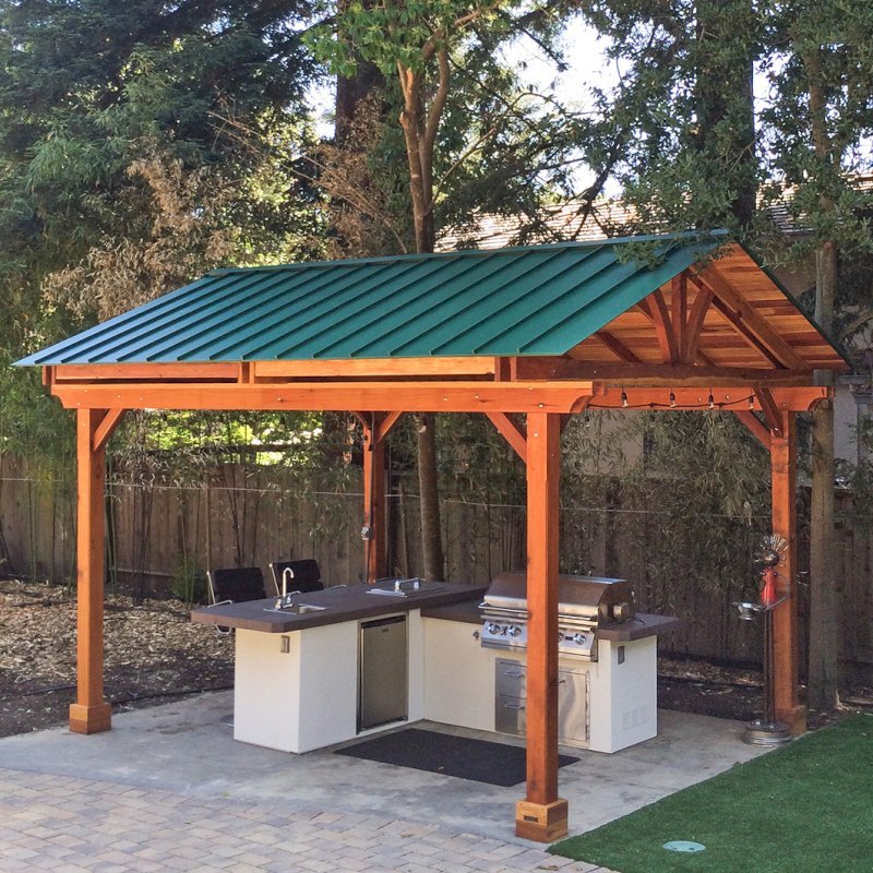 Del Norte Outdoor Kitchen Pavilion (Options: 16' L x 13' W, California Redwood, Unattached, 4-Post Kit for Hurricane, No Electrical Wiring Trim, 9' Posts, No Ceiling Fan Base, No Privacy Panels, No Curtain Rods, Transparent Premium Sealant). Standing Seam Metal Roof added by Customer Request. Photo Courtesy of Steve Aber of Atherton, CA. Del Norte Outdoor Kitchen Pavilion (Options: 16' L x 13' W, California Redwood, Unattached, 4-Post Kit for Hurricane, No Electrical Wiring Trim, 9' Posts, No Ceiling Fan Base, No Privacy Panels, No Curtain Rods, Transparent Premium Sealant). Standing Seam Metal Roof added by Customer Request. Photo Courtesy of Steve Aber of Atherton, CA.