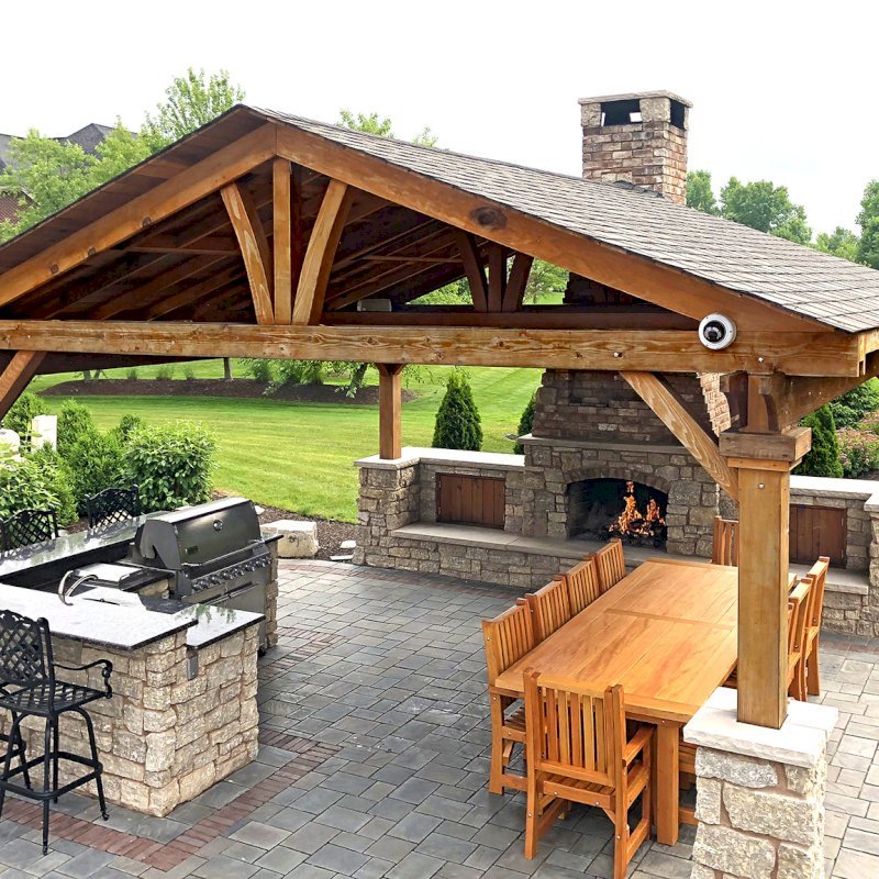 Del Norte Outdoor Kitchen Pavilion (Options: 20' L x 20' W, California Redwood, 4-Post Kit for Gale-Wind, 1 Ceiling Fan Base, Transparent Premium Sealant, Custom Cut Out in the Back Overhang to Fit the Fireplace). Photo Courtesy of Tom Mislenkov of Chesterton, Indiana. Del Norte Outdoor Kitchen Pavilion (Options: 20' L x 20' W, California Redwood, 4-Post Kit for Gale-Wind, 1 Ceiling Fan Base, Transparent Premium Sealant, Custom Cut Out in the Back Overhang to Fit the Fireplace). Photo Courtesy of Tom Mislenkov of Chesterton, Indiana.