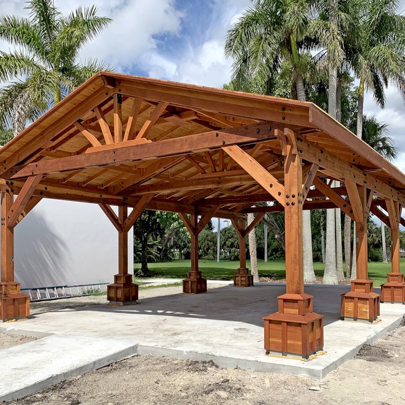 Custom Del Rio Cathedral Ceiling Thick Timber Pavilion (Options: 36' L x 24' Triangle Base W, No Privacy Panels, Douglas-fir, 10' ft Height, Electrical Wiring Trims for All Posts, With Custom Anchors and Hardware, Custom Trim Boxes at the Bottom of the Posts (Boots), 3 Ceiling Fan Bases, No Curtain Rods, Transparent Premium Sealant). Photo Courtesy of F. Gourdouze of West Palm Beach, Florida. Custom Del Rio Cathedral Ceiling Thick Timber Pavilion (Options: 36' L x 24' Triangle Base W, No Privacy Panels, Douglas-fir, 10' ft Height, Electrical Wiring Trims for All Posts, With Custom Anchors and Hardware, Custom Trim Boxes at the Bottom of the Posts (Boots), 3 Ceiling Fan Bases, No Curtain Rods, Transparent Premium Sealant). Photo Courtesy of F. Gourdouze of West Palm Beach, Florida.