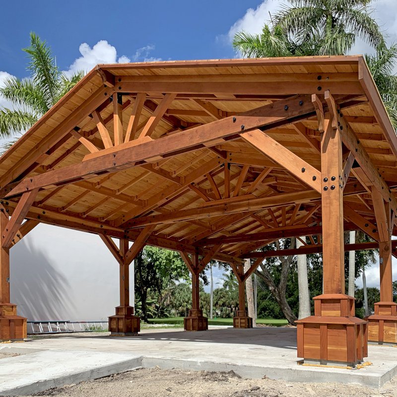Custom Del Rio Cathedral Ceiling Thick Timber Pavilion (Options: 36' L x 24' Triangle Base W, No Privacy Panels, Douglas-fir, 10' ft Height, Electrical Wiring Trims for All Posts, With Custom Anchors and Hardware, Custom Trim Boxes at the Bottom of the Posts (Boots), 3 Ceiling Fan Bases, No Curtain Rods, Transparent Premium Sealant). Photo Courtesy of F. Gourdouze of West Palm Beach, Florida. Custom Del Rio Cathedral Ceiling Thick Timber Pavilion (Options: 36' L x 24' Triangle Base W, No Privacy Panels, Douglas-fir, 10' ft Height, Electrical Wiring Trims for All Posts, With Custom Anchors and Hardware, Custom Trim Boxes at the Bottom of the Posts (Boots), 3 Ceiling Fan Bases, No Curtain Rods, Transparent Premium Sealant). Photo Courtesy of F. Gourdouze of West Palm Beach, Florida.