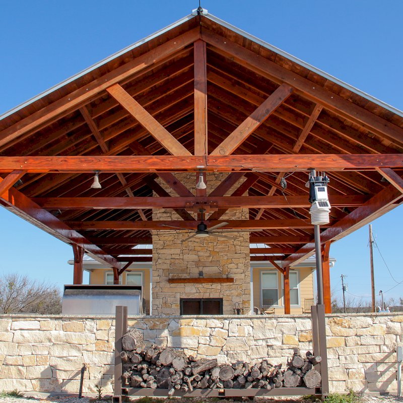 Del Rio Cathedral Ceiling Thick Timber Pavilion (Options: 42' L x 22' Triangle Base W, No Privacy Panels, Mature Redwood, 10' ft Height, Electrical Wiring Trim for 1 Post, 6-Post Hurricane Anchor Kit, No Post Decorative Trim, 2 Ceiling Fan Bases, No Curtain Rods, Transparent Premium Sealant). Note: Fireplace and kitchen counter was added after the Pavilion was installed by a Mason. Forever Redwood does not do masonry work, but our designs can incorporate them. Del Rio Cathedral Ceiling Thick Timber Pavilion (Options: 42' L x 22' Triangle Base W, No Privacy Panels, Mature Redwood, 10' ft Height, Electrical Wiring Trim for 1 Post, 6-Post Hurricane Anchor Kit, No Post Decorative Trim, 2 Ceiling Fan Bases, No Curtain Rods, Transparent Premium Sealant). Note: Fireplace and kitchen counter was added after the Pavilion was installed by a Mason. Forever Redwood does not do masonry work, but our designs can incorporate them.