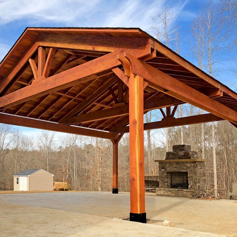 Del Rio Cathedral Ceiling Thick Timber Pavilion (Options: 22' x 22', California Redwood, 4-Post Kit for Hurricane, With 2 Ceiling Fan Bases, Electrical Wiring Trim Kit for 1 Post, No Post Decorative Trim, Transparent Premium Sealant, 1 1/2" x 11 1/4" Supports and Rafters by Custom Request). Has some customized details. Photo Courtesy of B. Morales of Clayton, NC. Del Rio Cathedral Ceiling Thick Timber Pavilion (Options: 22' x 22', California Redwood, 4-Post Kit for Hurricane, With 2 Ceiling Fan Bases, Electrical Wiring Trim Kit for 1 Post, No Post Decorative Trim, Transparent Premium Sealant, 1 1/2" x 11 1/4" Supports and Rafters by Custom Request). Has some customized details. Photo Courtesy of B. Morales of Clayton, NC.