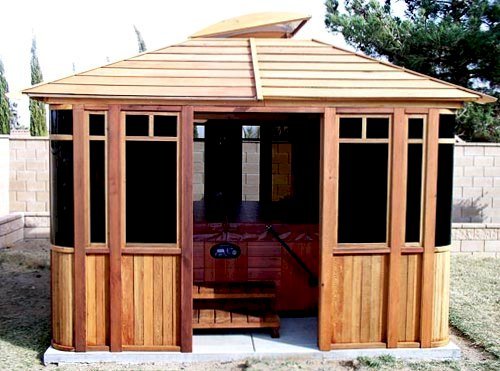 DIY Wood Gazebo (14' L, 12' W, Mature Redwood, Sliding Windows, 4' x 6' Skylight, 24" H Siding Below Windows, Vertical Siding, Japanese Doors, No Flooring, Transparent Premium Sealant). Photo also show a Spa Step inside the gazebo. Custom detail: Roof overhang was minimized per customer request. DIY Wood Gazebo (14' L, 12' W, Mature Redwood, Sliding Windows, 4' x 6' Skylight, 24" H Siding Below Windows, Vertical Siding, Japanese Doors, No Flooring, Transparent Premium Sealant). Photo also show a Spa Step inside the gazebo. Custom detail: Roof overhang was minimized per customer request.