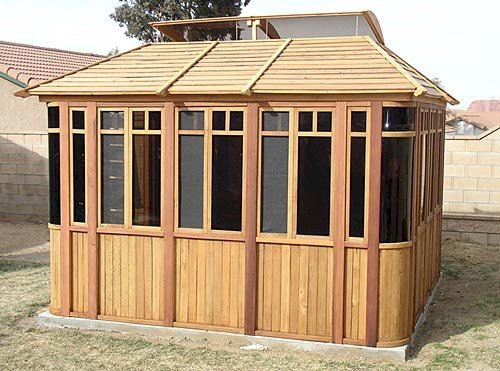 DIY Wood Gazebo (14' L, 12' W, Mature Redwood, Sliding Windows, 4' x 6' Skylight, 24" H Siding Below Windows, Vertical Siding, Japanese Doors, No Flooring, Transparent Premium Sealant). Custom detail: Roof overhang was minimized per customer request. DIY Wood Gazebo (14' L, 12' W, Mature Redwood, Sliding Windows, 4' x 6' Skylight, 24" H Siding Below Windows, Vertical Siding, Japanese Doors, No Flooring, Transparent Premium Sealant). Custom detail: Roof overhang was minimized per customer request.