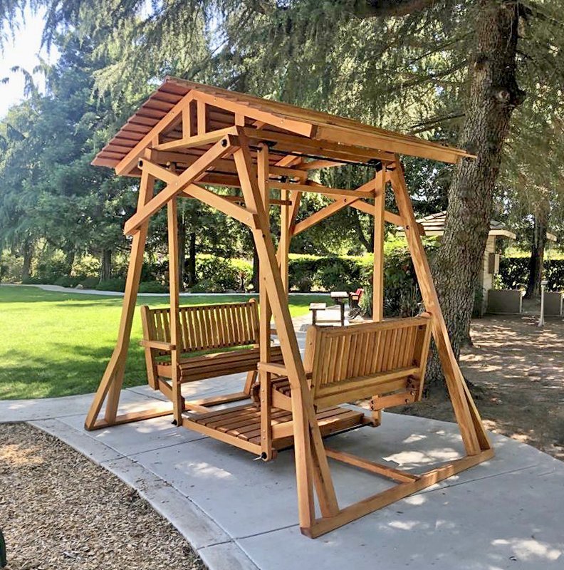 Dustin's Face to Face Gliders (Options: Douglas-fir, Standard Roof, Without Beverage Armrest, No Kid's Platform, Custom Engraving, Transparent Premium Sealant). Photo Courtesy of Gary & Kathy Dei Rossi of Manteca, CA.. Dustin's Face to Face Gliders (Options: Douglas-fir, Standard Roof, Without Beverage Armrest, No Kid's Platform, Custom Engraving, Transparent Premium Sealant). Photo Courtesy of Gary & Kathy Dei Rossi of Manteca, CA..