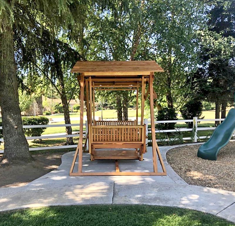 Dustin's Face to Face Gliders (Options: Douglas-fir, Standard Roof, Without Beverage Armrest, No Kid's Platform, Custom Engraving, Transparent Premium Sealant). Photo Courtesy of Gary & Kathy Dei Rossi of Manteca, CA.. Dustin's Face to Face Gliders (Options: Douglas-fir, Standard Roof, Without Beverage Armrest, No Kid's Platform, Custom Engraving, Transparent Premium Sealant). Photo Courtesy of Gary & Kathy Dei Rossi of Manteca, CA..