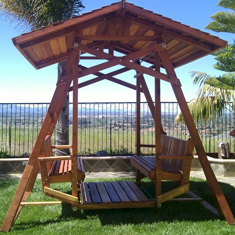 Dustin's Face to Face Gliders (Options: California Redwood, XW Roof, Without Beverage Armrest, No Kid's Platform, No Engraving, Transparent Premium Sealant). Photo Courtesy of Teresa D. Ali of San Jose, CA. Dustin's Face to Face Gliders (Options: California Redwood, XW Roof, Without Beverage Armrest, No Kid's Platform, No Engraving, Transparent Premium Sealant). Photo Courtesy of Teresa D. Ali of San Jose, CA.