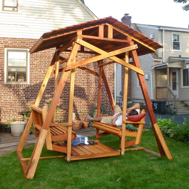 Dustin's Face to Face Glider after a hard day of assembly work (Options: California Redwood, Standard Roof, Without Beverage Armrest, No Kid's Platform/Sidetable, No Engraving, Transparent Premium Sealant). Photo Courtesy of Girish Sharma of Belleville, NJ. Dustin's Face to Face Glider after a hard day of assembly work (Options: California Redwood, Standard Roof, Without Beverage Armrest, No Kid's Platform/Sidetable, No Engraving, Transparent Premium Sealant). Photo Courtesy of Girish Sharma of Belleville, NJ.