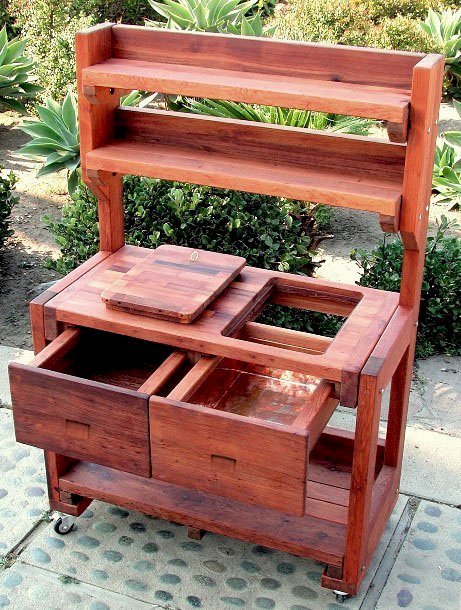 Eli's Redwood Potting Bench (Options: Standard Size, Old-Growth Redwood, Casters, 2 Shelves, Copper Inset for Right Drawer, No Engraving, Removable Lid on Right Side, Transparent Premium Sealant). Photo shows tabletop lid removed. Eli's Redwood Potting Bench (Options: Standard Size, Old-Growth Redwood, Casters, 2 Shelves, Copper Inset for Right Drawer, No Engraving, Removable Lid on Right Side, Transparent Premium Sealant). Photo shows tabletop lid removed.